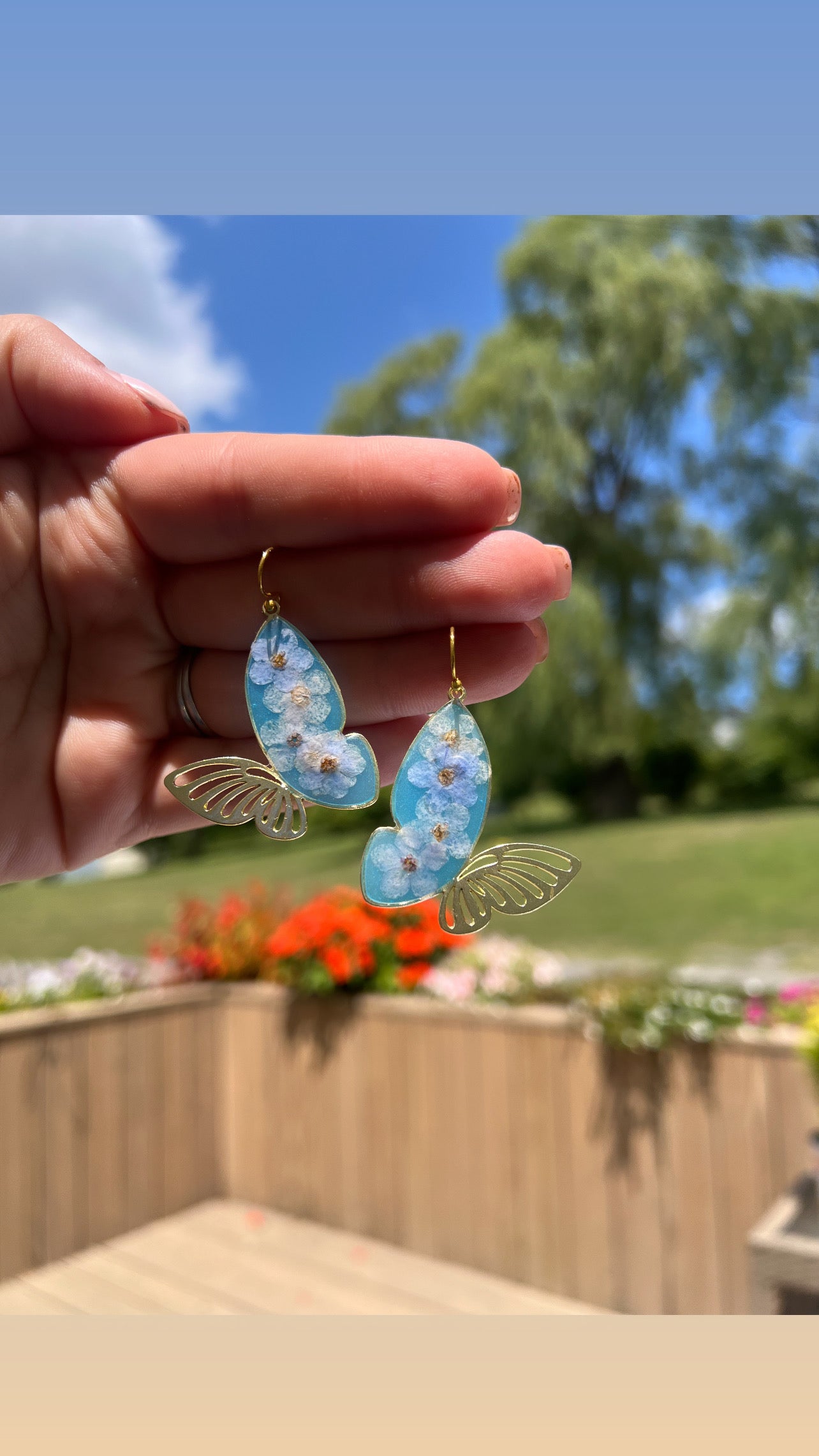 Butterfly dangles with forget me nots